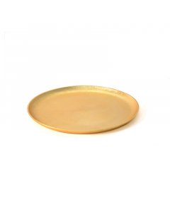 A large golden round serving plate