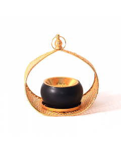 Black incense burner with a golden handle
