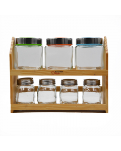 A set of spices cans with a wooden stand