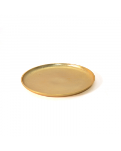 A medium golden round serving plate